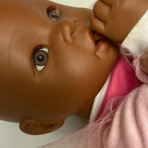 Infant Doll with Realistic Facial Features and Brown Skin
